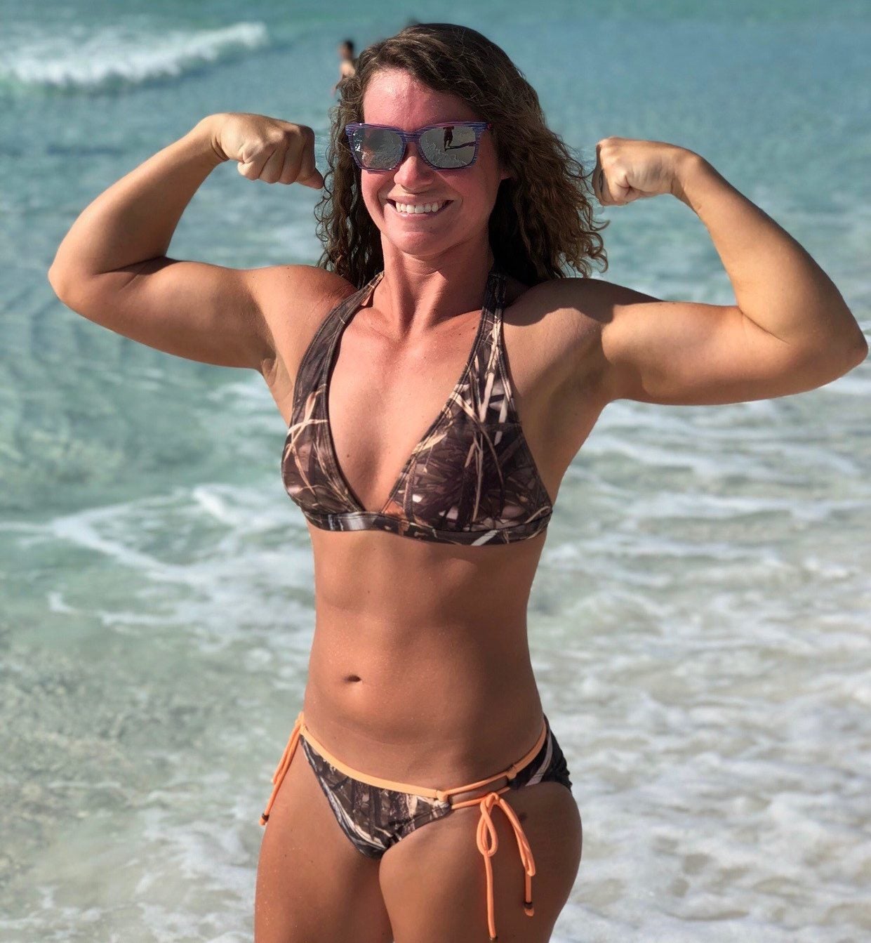Sara Veal flexing