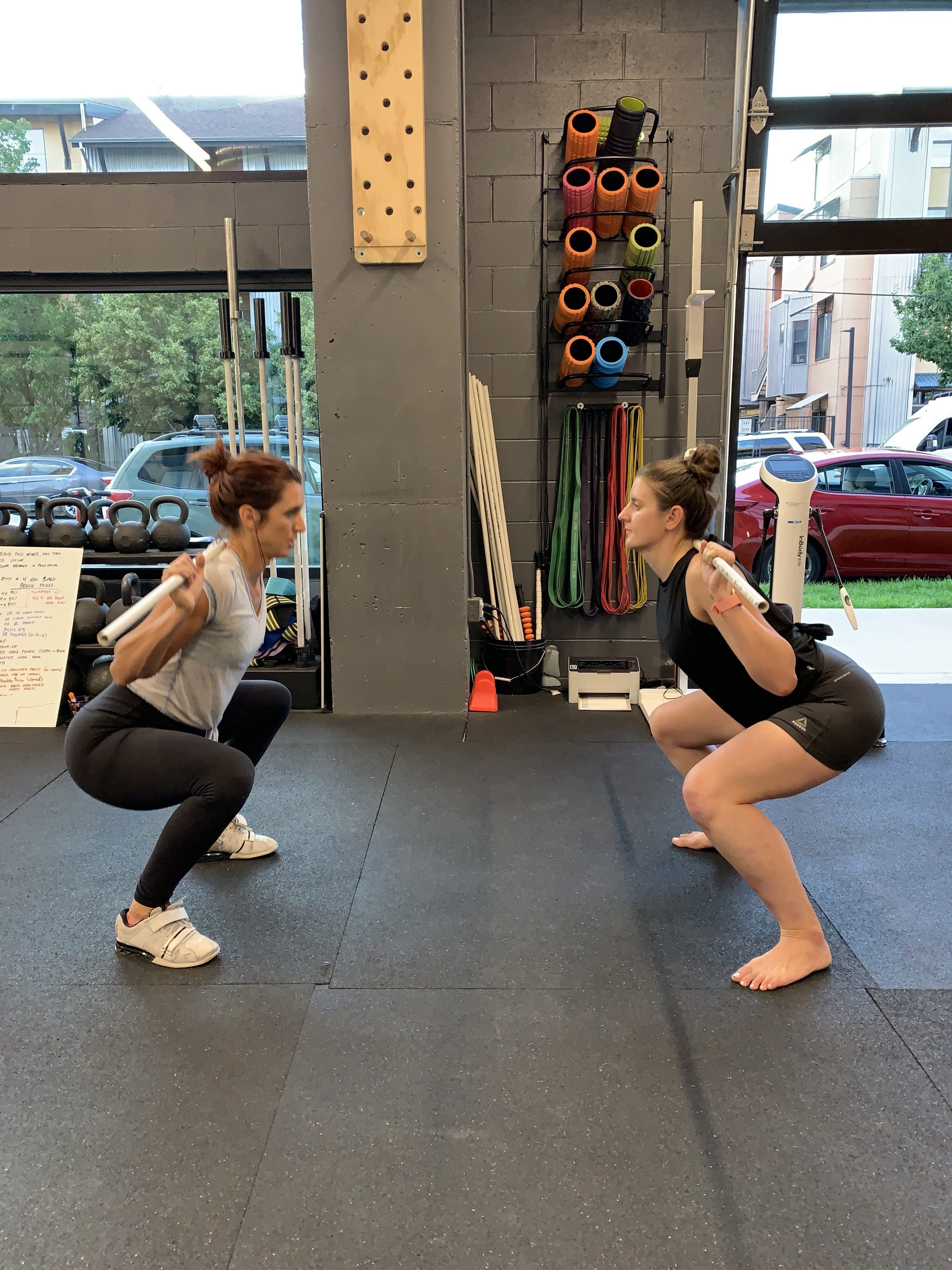 Sam and Emily practicing powerlifting