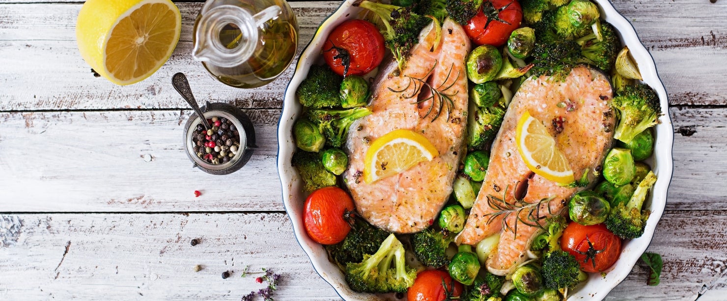 Baked salmon steak with vegetables. Diet menu. Top view