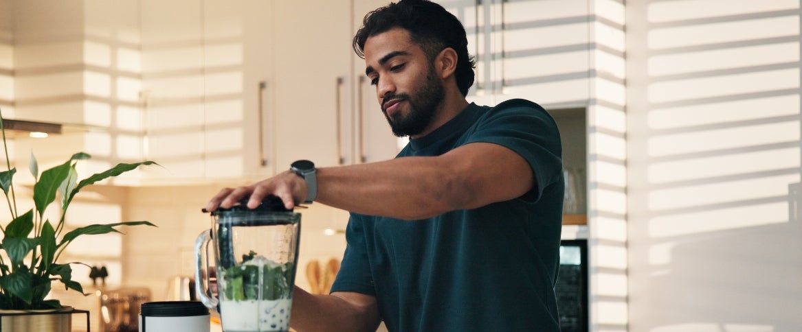 fibermaxxing: young man making smoothie