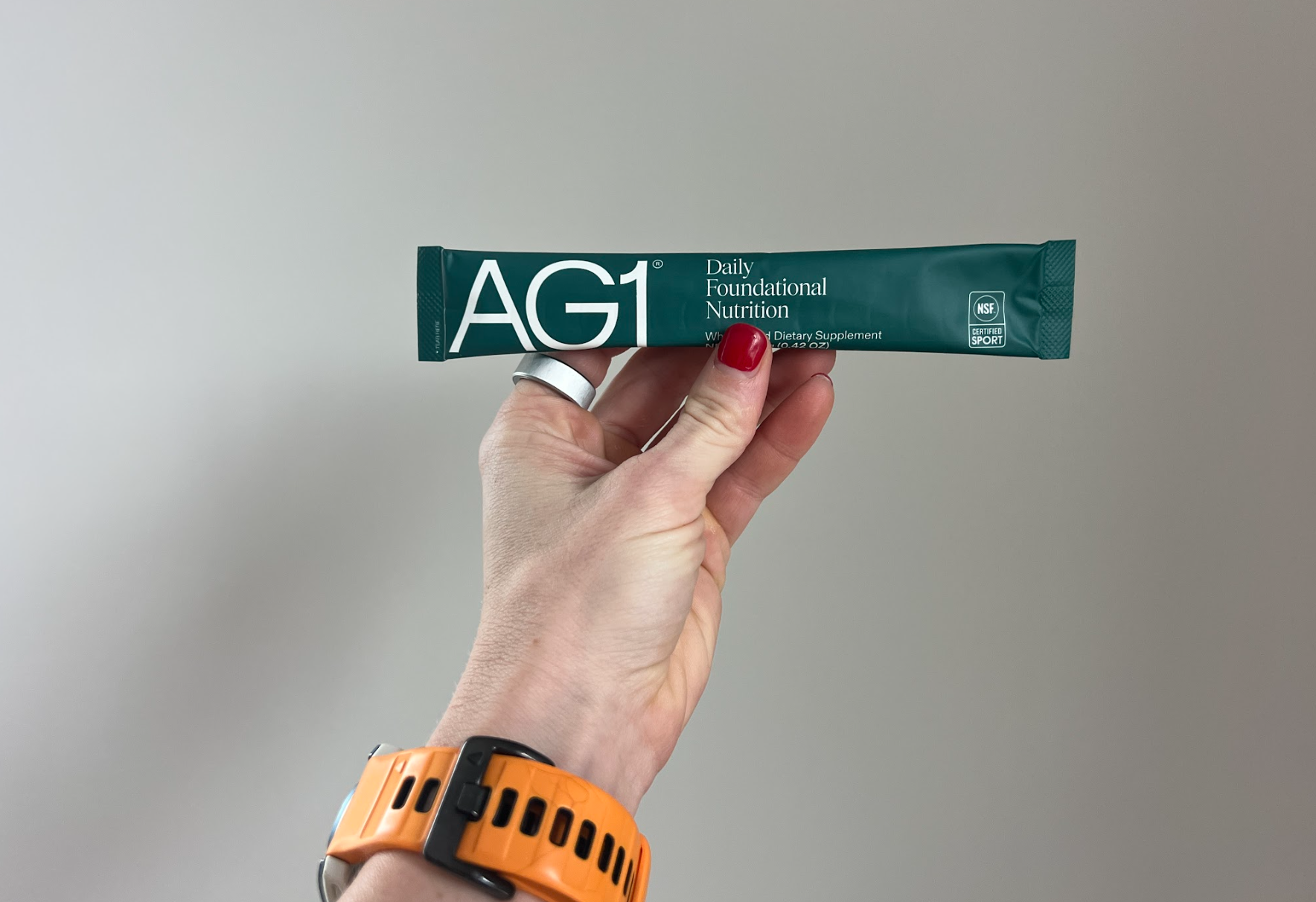 hand holding AG1 packet